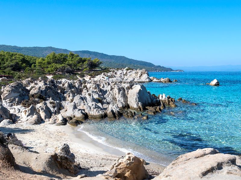 Coastal landscape in Paros with bright blue waters, frequently included in rental ATV sightseeing routes.
